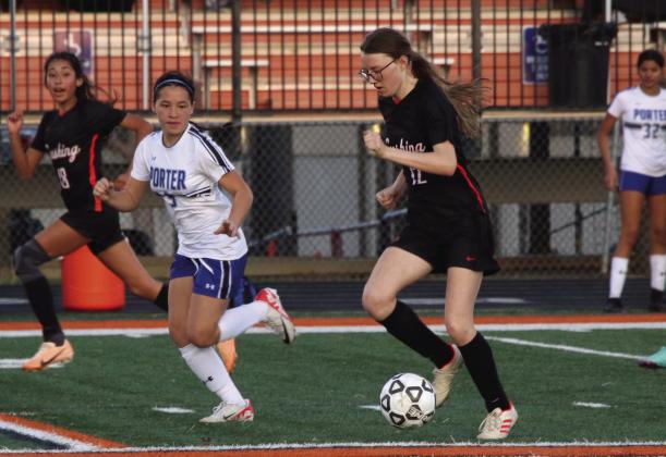 Cushing Lady Tiger Bella Keyes dribbles down the field during the Lady Tigers game against Porter, Tuesday, March 5. Lady Tigers lost 0-7. Lady Tigers will play again Friday at home against Newkirk. Photo by Allie Prater