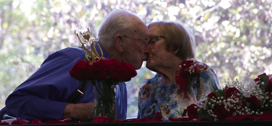 Orvel and Virginia Sherrill sneak in a kiss during their 80th anniversary celebration last Friday. Photo by Allie Prater.