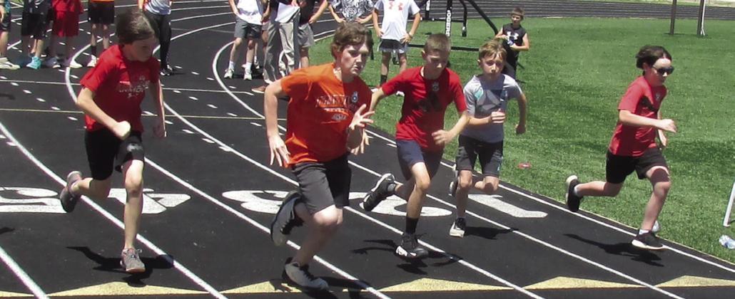 Ethan Church has an early lead during the fifth grade boys 100-yd dash. Participants pictured from left are Landon Thrasher, Church, Teagen Wood, Tyson Carmichael, and Tyler Harrison. Photos by DeAnna Maddox