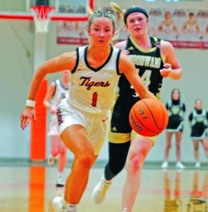 Senior Lady Tiger Kinsley Williams heads for transition basket during the regional tournament hosted by Cushing last week. Photo by Amber Fausto