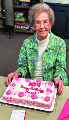 Hazel Cusac recently celebrated her 104th Birthday at the Cushing Senior Citizens Center. Here she is pictured with her cake. She enjoys coming to the Senior Center every week to play bridge.
