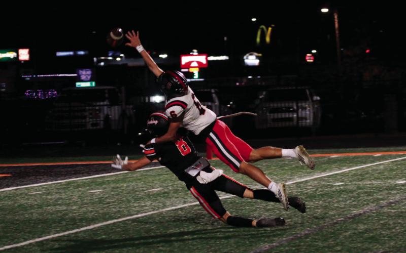 This is what interference looks like as Hilldale free safety Aidan Lindquist takes a ride on the back of Cushing receiver Jordan Kersey. Photo by J. D. Meisner