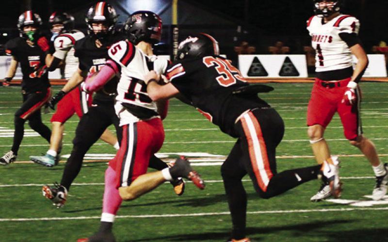 This tackle by Jake Martin may have looked like a horse collar from the point of view of the officials Friday, but it was all jersey and all Cushing Tiger Jake Martin. Photo by J. D. Meisner