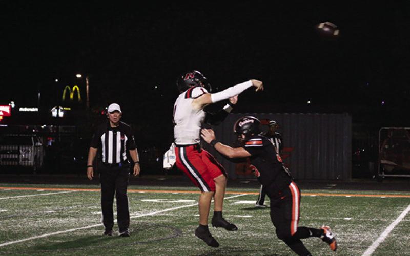 Hilldale QB Dawson Fields was hurried out of the pocket all night by a relentless Tiger defensive squad.