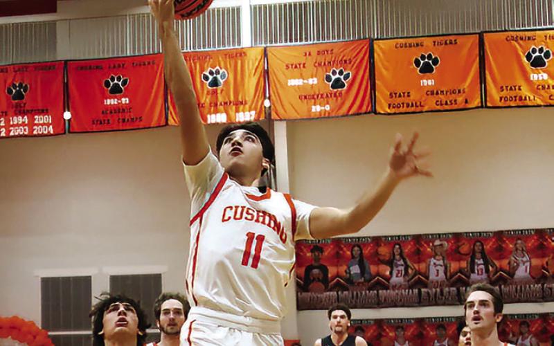 Kanaan Guerrero makes a transition layup against Kiefer. Photos by J. D. Meisner