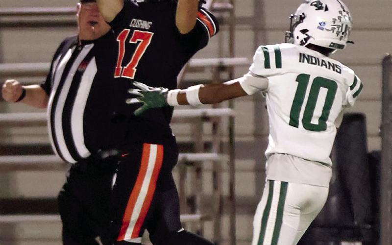 Senior Bryce Ward reaches for the catch. Photos by Sylvia Danyele