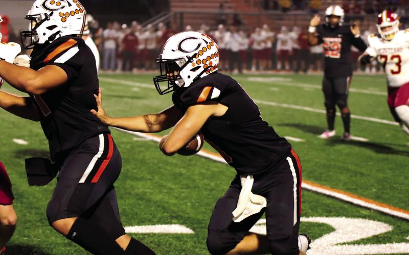 Senior quarterback John Hilligoss follows the lead of Nose Guard Michael Cruz on his way to a touchdown against Cleveland Friday night at O’Dell Field. Photos by Cindy Wayland. CLASS 4A Rankings Week 9 1. Wagoner (1) 8-0 2. Poteau (2) 8-0 3. Ada (3) 8-0 4. Blanchard (4) 7-1 5. Tuttle (5) 6-2 6. Newcastle (6) 7-1 7. Cushing (7) 6-2 8. Clinton (8) 5-2 9. Bethany (9) 6-2 10. Sallisaw (10) 5-3