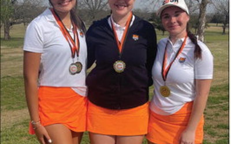 Lady Tigers Addisyn Fields, Ayla Britt, and Ashlyn Floyd stand together after the tournament. All three ladies placed in the top 10. Photo by Dena Floyd.