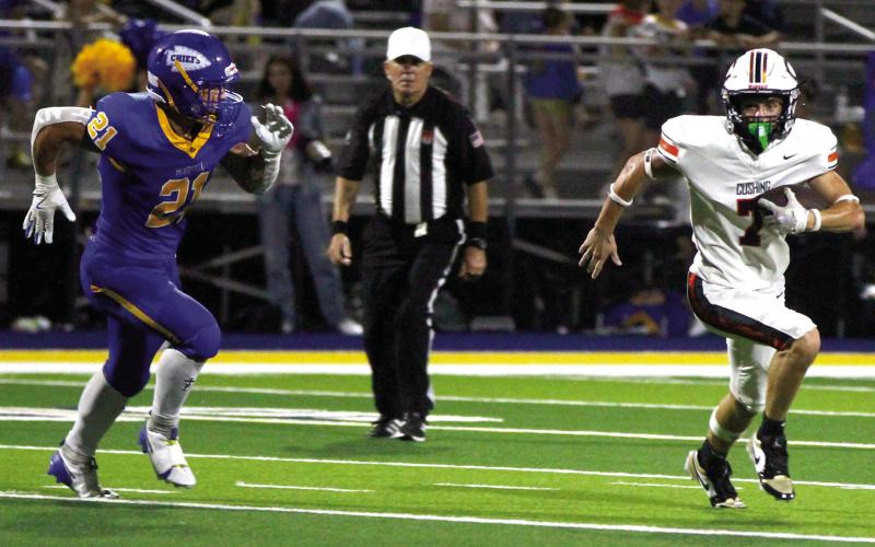 Lane Simpson blows past Berryhill containment. Photos by Sylvia Danyele