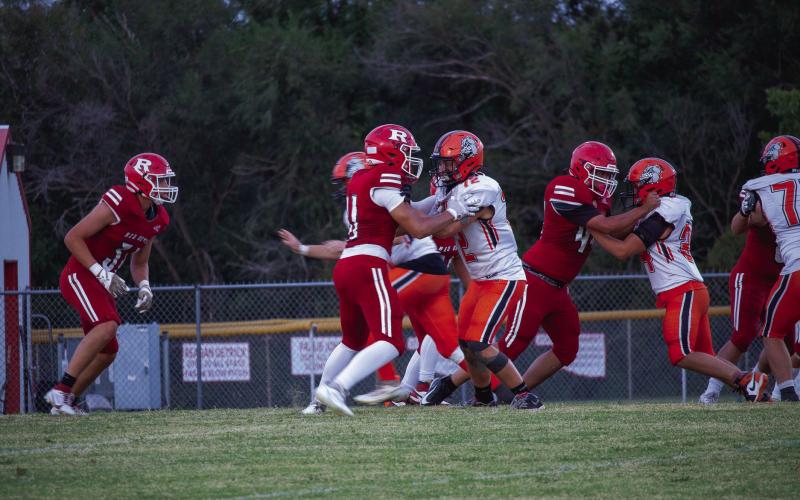 Bulldog junior Levi Benjamin makes a block.