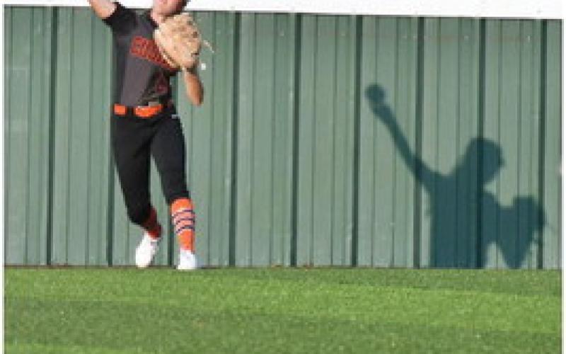 Romey Withiam relays a ball in from the fence. The Lady Tiger defense was on point Friday.