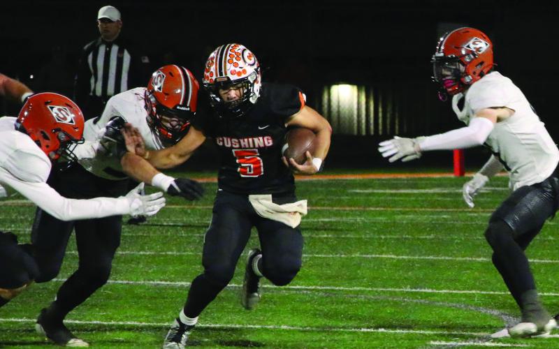 Johnny Hilligoss muscles through Sallisaw defenders. Photo by Allie Prater