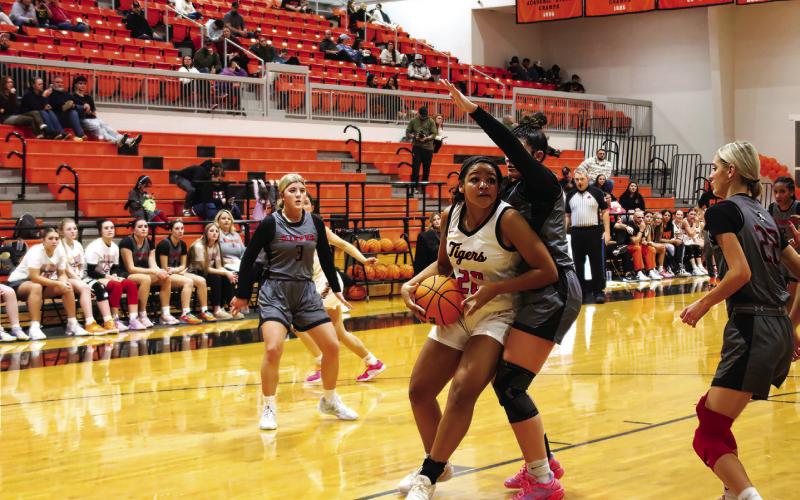 Makiah Shanklin hooks an elbow and gets past a Kiefer defender. Photo by J. D. Meisner