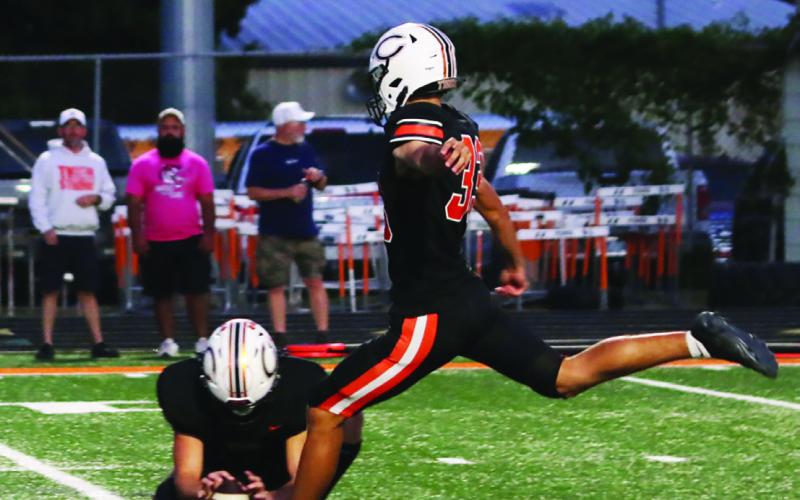 Landon Miller winds up to kick a 35-yard field goal.