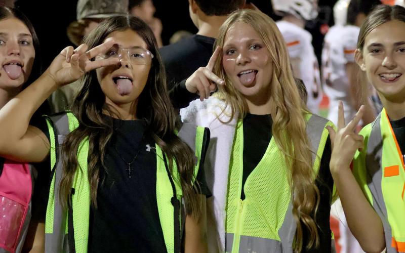 Ella Tusler, Madi Garcia, Clara Deaton, and Morgan Chisolm support their Tigers in Skiatook. Photo by Sylvia Danielle