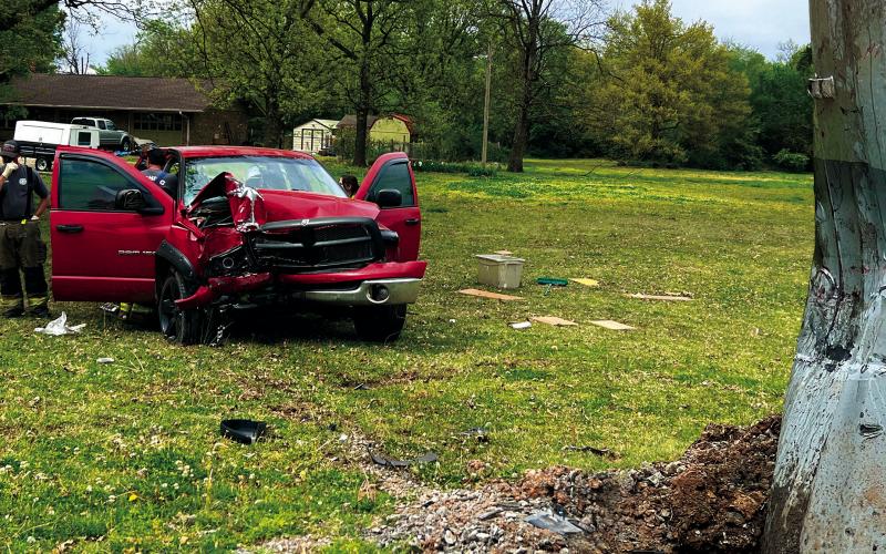 Members of the Cushing Fire Department and EMS work the scene of a truck vs power pole accident in Ninth Street last week. The driver of the truck was seriously injured and flown to OU Medical Center in Oklahoma City. Photo by J.D. Meisner