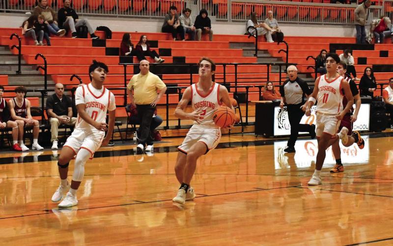 Lane Wood gathers for a layup against Cleveland. Cushing defeated Cleveland 65-40. Photo by Sarah Townes