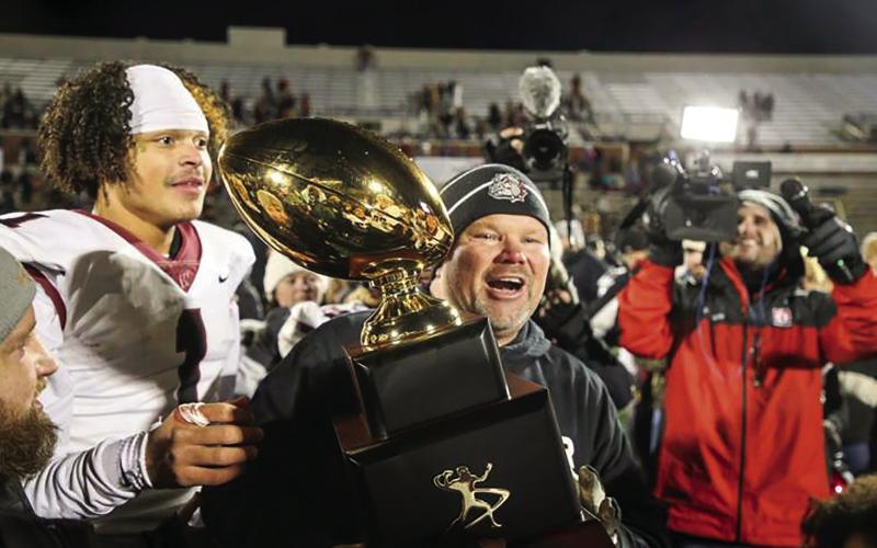 Former Wagoner Head Coach Dale Condict celebrates another Golden Ball trophy with his Bulldogs — Tulsa World Photo