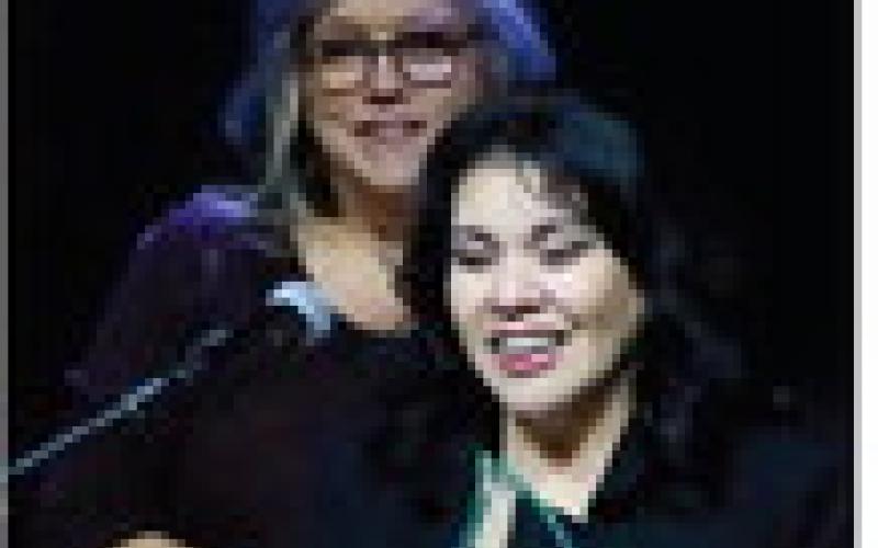 Elvia Bustos accepts the Cushing Chamber of Commerce Small Business of the Year Award while Vera Huckabay offers congratulations. Photo by J. D. Meisner