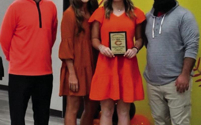 Gracyn Presley was named offensive player of the year. She is flanked by, from left, assistant coach Jeff Wintz, head coach Nikki York and assistant coach Josh Encinas.