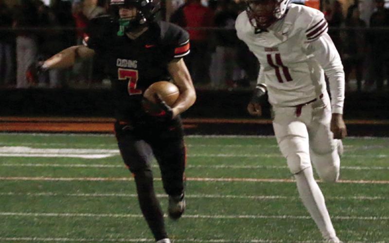 Lane Simpson prepares to activate the afterburners as he turns the corner.