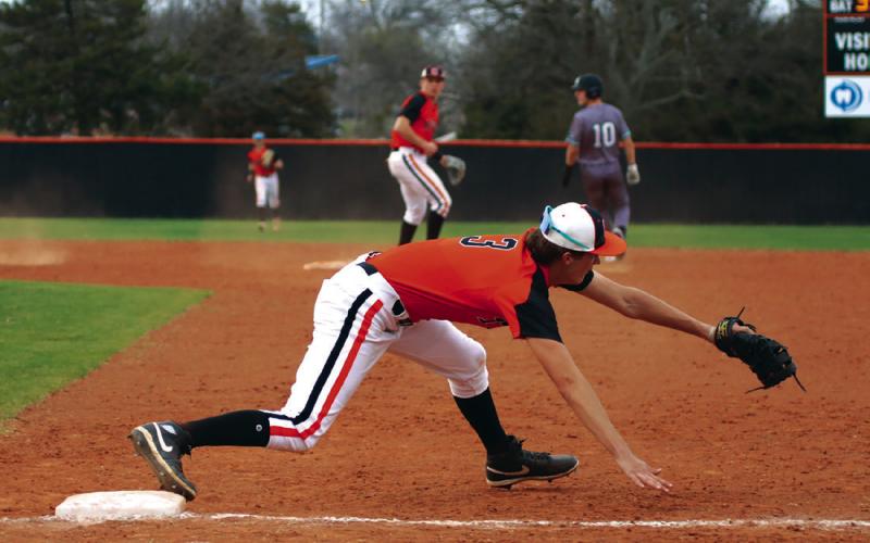 With the ball in the glove and a foot on the base, Cushing’s Ethan Evans makes what should have been an impact-play at first. The umpires saw it the other way and called the Jones runner safe at first.
