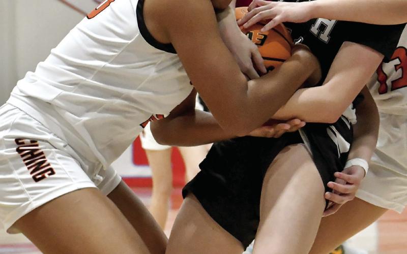Makiah Shanklin battles for possession against Pond Creek. Photos by Sarah Townes