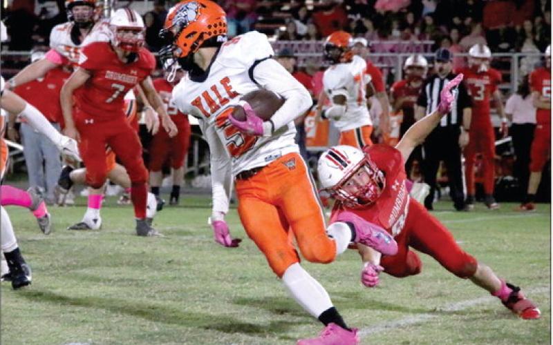 Caymon Prather jukes past a Tornado defender. Photo by Allie Prater