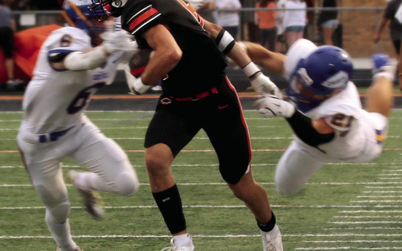 Max Wood turns and burns down the sideline during the second quarter of the Cushing, Berryhill game. Wood suffered a leg injury in the fourth quarter and is not expected to play against Bristow this week.