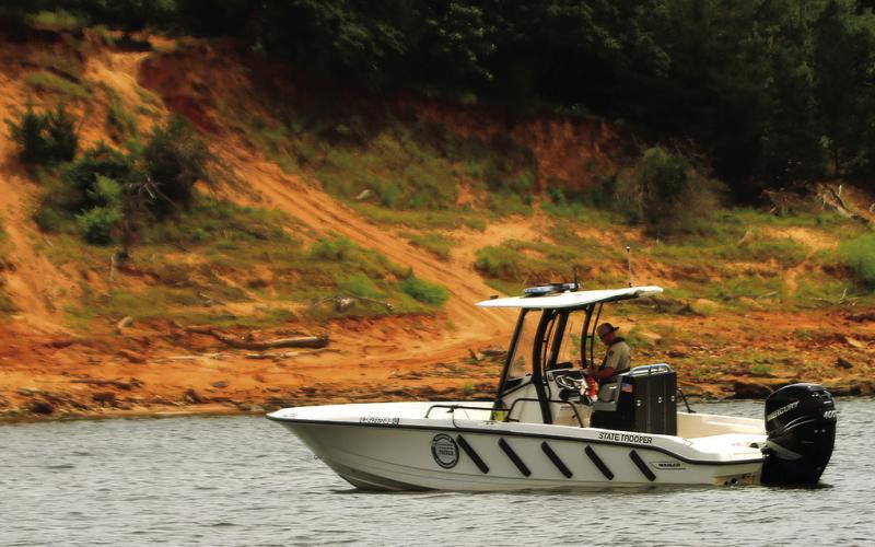 Trooper Ryan Griffith of the OHP’s Marine Division patrols the Cimarron Arm of Keystone Lake near Appalachia Bay Recreation Area Friday. Griffith was among the first to respond to July 4’s double drowning at Keystone. Photo by J.D. Meisner