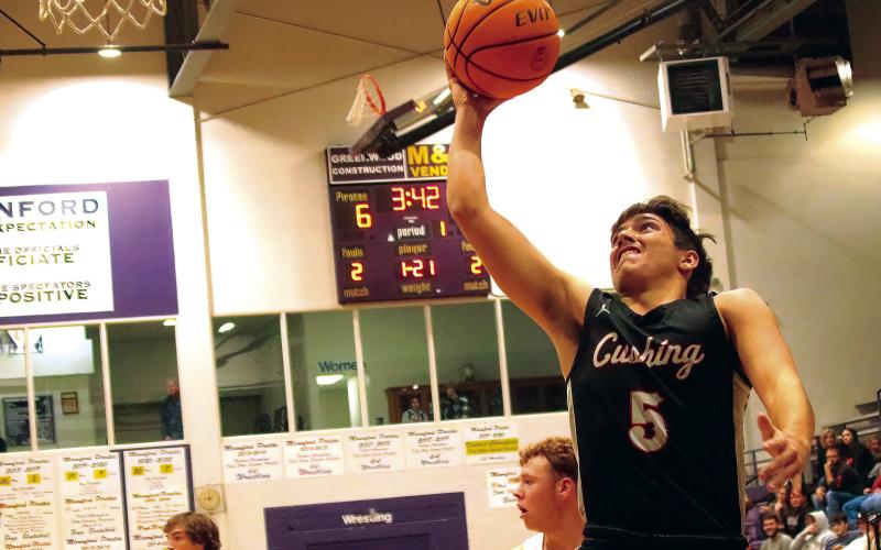 Johnny Hilligoss charges in for a layup.
