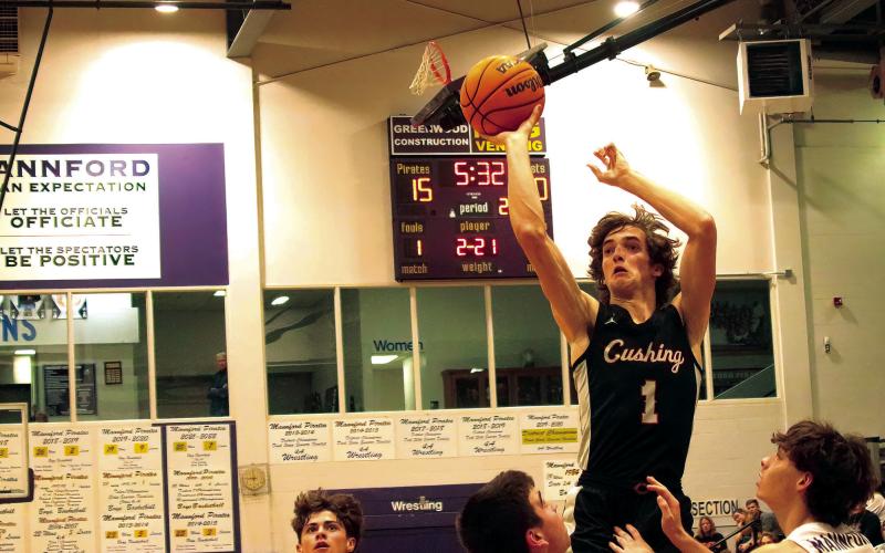 Max wood converts an offensive rebound into points with a mid-range jumper. Photos by J. D. Meisner