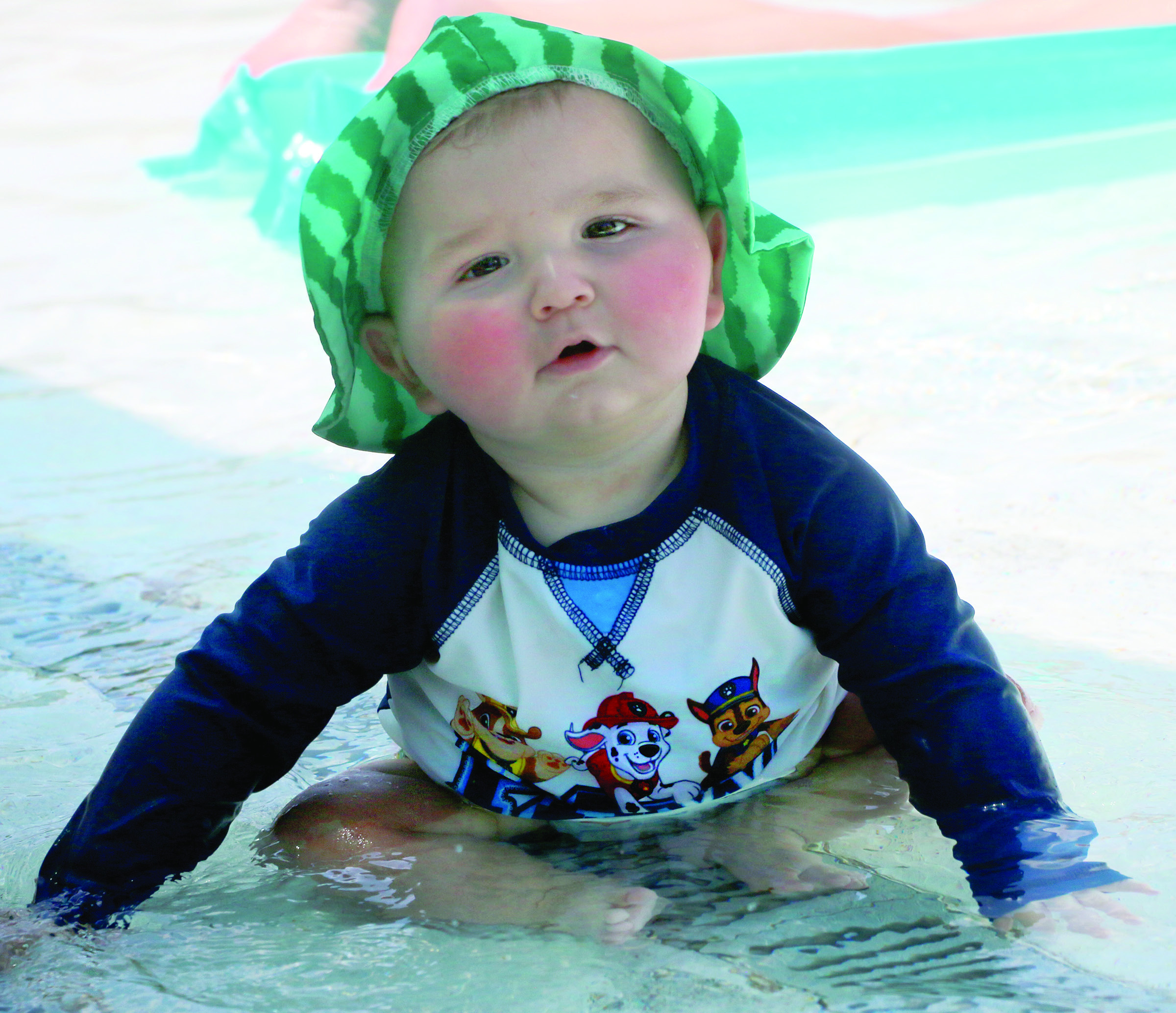 Sun kissed nine month old Abel Viator splashes in the kiddie pool at the Cushing Aquatic Center Monday, June 1. Photo by Allie Prater
