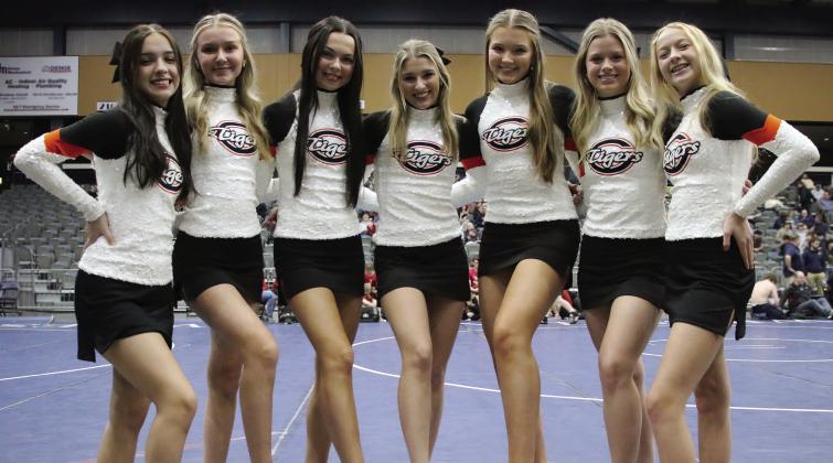 Cushing Cheerleaders Ellie Andrews, Gracie Hickman, Anna Mae Nighswonger, Ava Babinec, Brittan Blakemore, Presley Elliott, and Anisten Campbell at the 2024 Dual State Wrestling tournament Friday, Feb. 9. Photo by Allie Prater