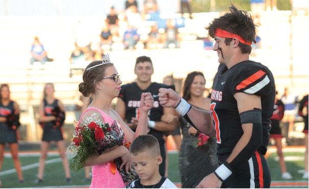 Cushing Tiger 2023 Football Homecoming Queen Kaylin Beitz fist bumps King Brady Matheson after coronation at the Tigers Homecoming game against the Miami Wardogs. Tigers beat the Wardogs 40-28, see full story inside. Photo by J.D. Meisner.