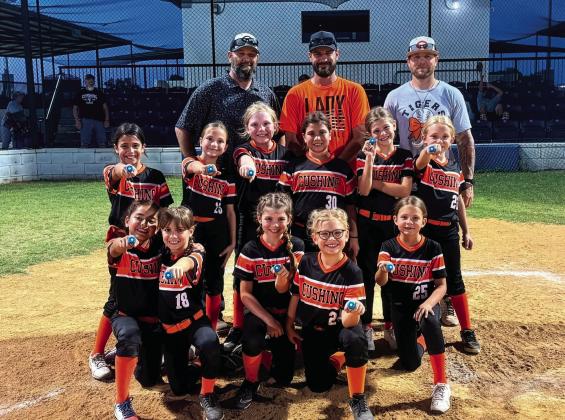 The Cushing Lady Tiger 8U softball team finished the season with an impressive 13-4 record and earned runner-up honors in the end-of-season tournament. They are, back row from left, Erik Brown, Jacob Westmoreland and Dustin Kelly. Middle row from left, Malia Rockwell, Kannyn Brown, Hadley Morgan, Athena Ka’ne, Gentry Westmoreland and Clare Delong. Front row from left, Ivette Cruz, Mia Fox, Taya Kelly, Reese Laurdale and Loxi Busby.