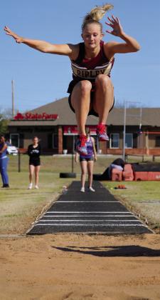 Lady Warrior Brooklyn Howell takes her qualifying leap in the long jump event at the Cushing Crossroads relay, Thursday, March 28. Photos by Allie Prater.