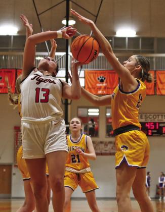 Ella Nanaeto battles for the boards against Bristow Friday. Nanaeto eight points, eight rebounds and four assists.