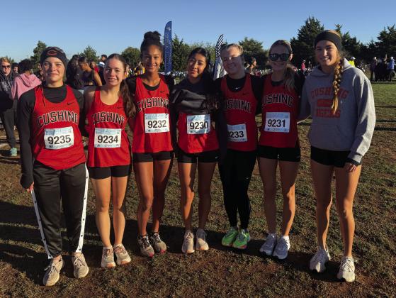 Lady Tiger varsity runners Macie Townes, Lea David, Kendall Kelley, Yohali Medrano, Pyper Hoppes, Marlee Myers and Harli York prior to their race at regionals at Bridge Creek. York finished eighth and the team qualified for state with a fourth-place finish.