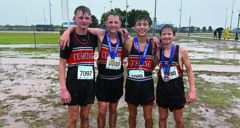 Junior High Cross Country Tigers Brice Bozworth, Keston Worthy, Gage Hoover and Hutson Calavan, soaked through, after their race Thursday. Hoover placed first, Worthy sixth, and Calvin 21st. The junior high boys were fourth overall as a team.