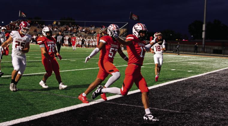 Cushing’s Gage Sharp celebrates as he crosses the goal line Thursday for the first of Cushing’s eight TD’s. Photo by J. D. Meisner