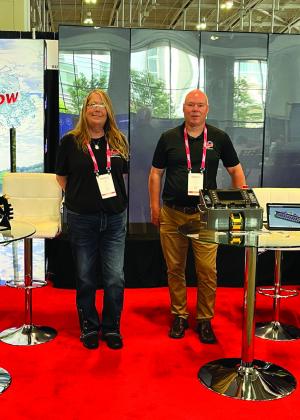 VMI Dredges Graphic Artist AK Chastain Jones and VMI Dredges President Cash Maitlan attend the IMX Inland Marine Expo in Nashville, Tennessee.