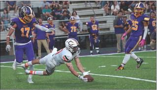 Senior receiver Brady Matheson makes a diving catch across the middle.