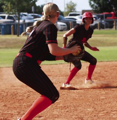 Peyton Lauderdale Holds off a Bishop Kelly runner at third. Photo by J. D. Meisner