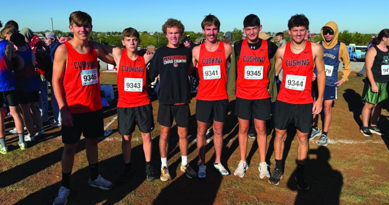 Tiger runners Aaron DeLong, Kaden Pendergraff, Fisher Moore, Kamden Evans, Kyler Claxton and Austin Kennedy, before their race at Bridge Creek. Evans finished sixth overall, qualifying for state with a personal best time and setting a new school record.
