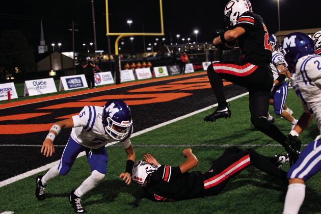 Drew Wood makes his own way toward the endzone against Miami Friday. Photo by J. D. Meisner