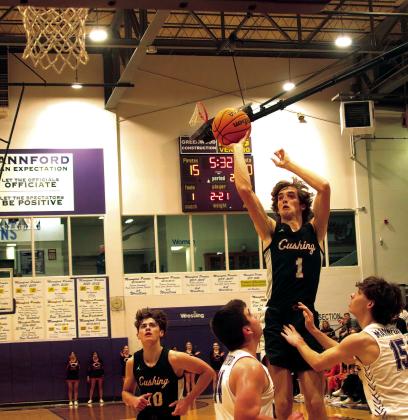 Max wood converts an offensive rebound into points with a mid-range jumper. Photos by J. D. Meisner