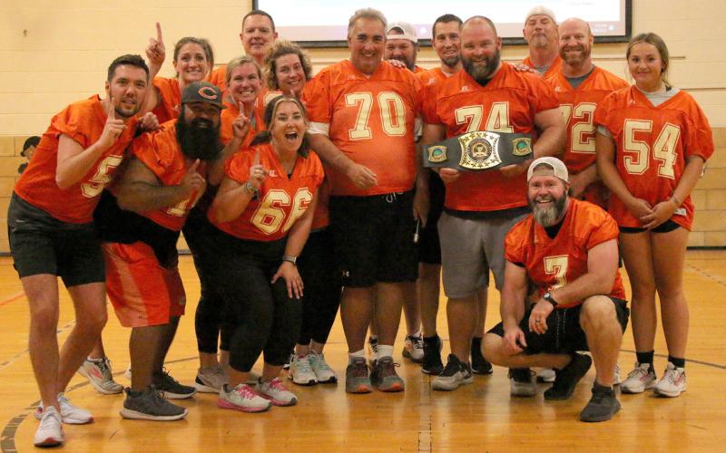 The winners of the inaugural Cushing Rotary Dodgeball Tournament, team Snoop Dodgey Dodge, stand proud with their championship belt Tuesday, Sept. 27. Pictured from left: Back row; JJ Wood, Lindsay Morgan, Melisa Amon, Jake Phillips, Jake Christensen, Bobby Hoover. Front row: Jared Bush, Josh Encinas, Don Amon, Rusty Morgan, Dave Brown, Faith Kessler, Jay Moore. 5