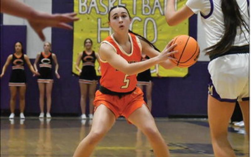 Lady Tiger Remi Powell looks for an open teammate.