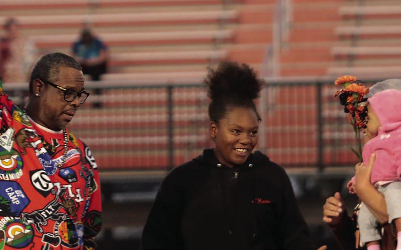 Band Member Sa’Kara Hagler, the grandaughter of Katherine Shinault and escorted by her Uncle Doc and Aunt Cindy Shinault